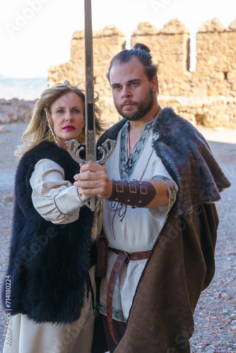 Medieval Warrior Couple Posing with Sword
