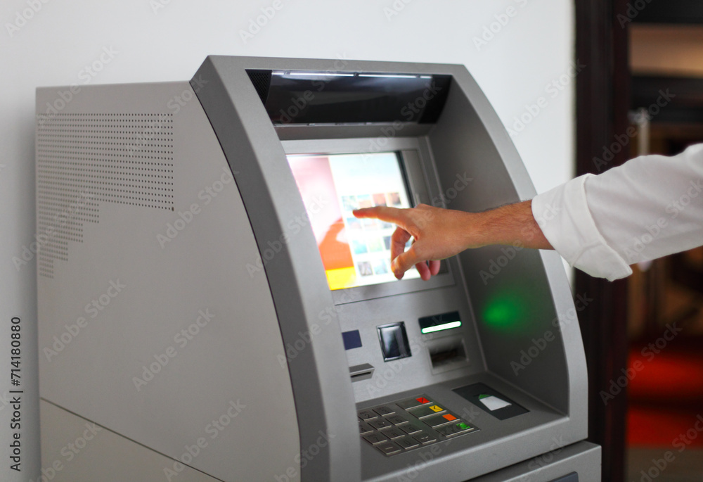 Man using banking machine Man using banking machine