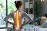 Shot with highlighted spine of woman with back pain