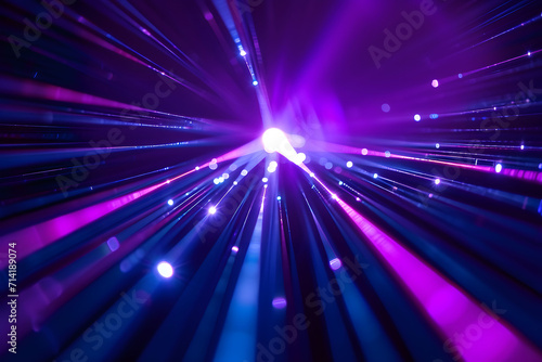 Blue and violet beams of bright laser light shining background