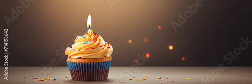 Cupcake With Lit Candle on Top photo
