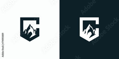 Letter C vector logo design with shield shape and mountain silhouette. photo