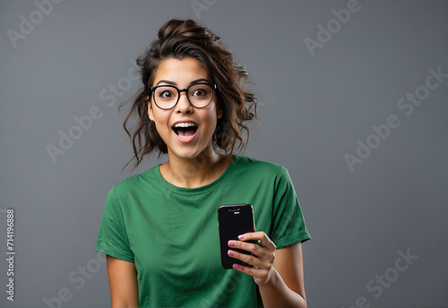 woman with mobile phone shocked and opens her mouth, looking amazed, look at wonder