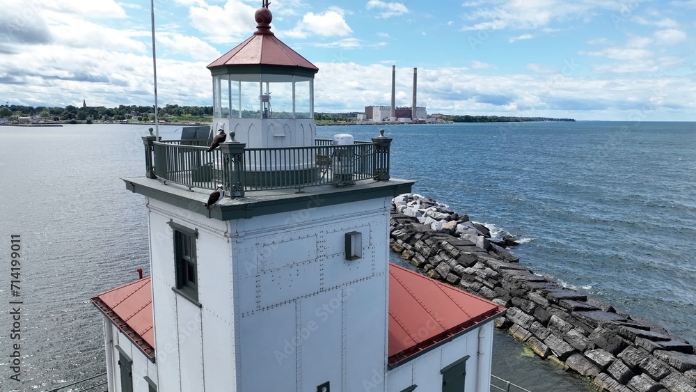 Lighthouse in Oswego New York close up on Lake Ontario at the mouth of Oswego River and harbor in small town on the coast of the Great Lake Historic Architecture Harbor beacon for boaters