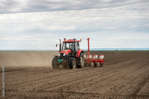 Sowing crops at agricultural fields in spring