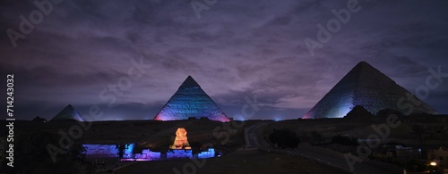Giza, Egypt - December 24 2023: The Pyramids and the Sphinx in the night lights