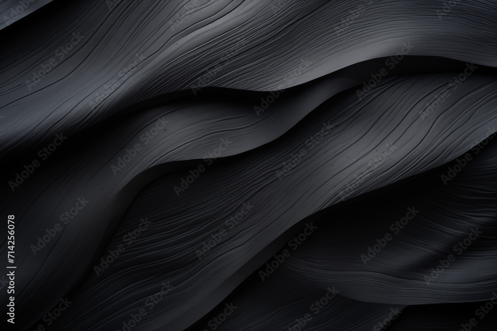 Obraz premium Abstract black fabric texture background with soft waves pattern