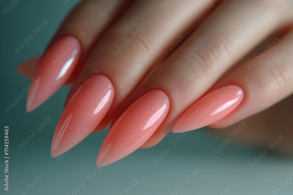 Beautiful womans hand with perfect peach nail design. Manicure, pedicure beauty salon concept Beautiful womans hand with perfect peach nail design. Manicure, pedicure beauty salon concept