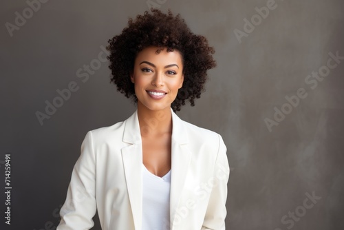 Confident black businesswoman in studio portrait.