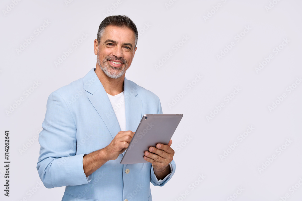 Happy middle aged business man ceo wearing suit standing isolated on white using digital tablet. Smiling mature businessman professional executive manager looking at camera holding device. Portrait Happy middle aged business man ceo wearing suit standing isolated on white using digital tablet. Smiling mature businessman professional executive manager looking at camera holding device. Portrait