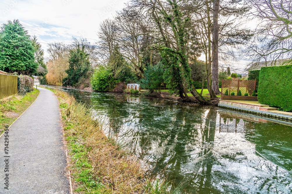 A view away from town along the towpath beside the frozen Grand Union canal in Market Harborough in Winter A view away from town along the towpath beside the frozen Grand Union canal in Market Harborough in Winter