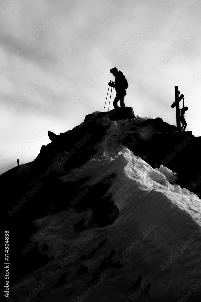 hiker in the mountains with cross