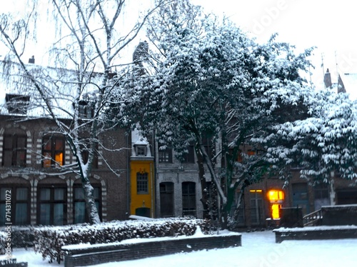 Lille, January 2024: Discover Lille, the capital of Flanders, under the snow. Snow-covered houses around Notre Dame de la Treille in Lille. photo