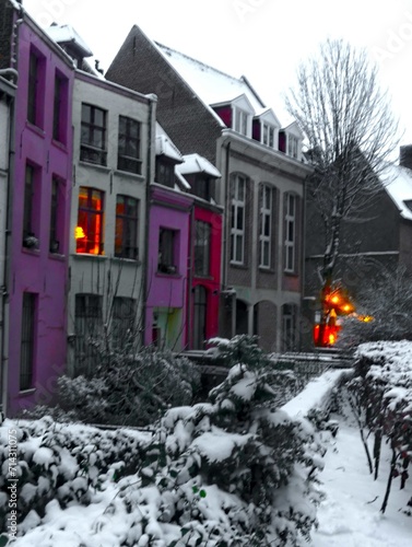 Lille, January 2024: Discover Lille, the capital of Flanders, under the snow. Snow-covered houses around Notre Dame de la Treille in Lille. photo