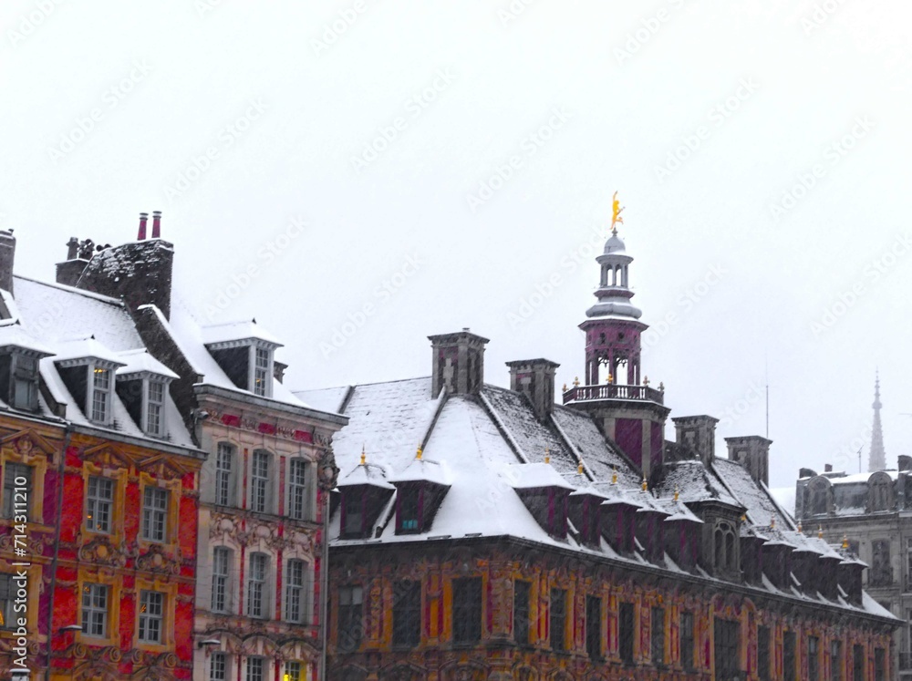 Fototapeta premium Lille, January 2024: Discover Lille, the capital of Flanders, under the snow. Old Lille stock exchange under snow