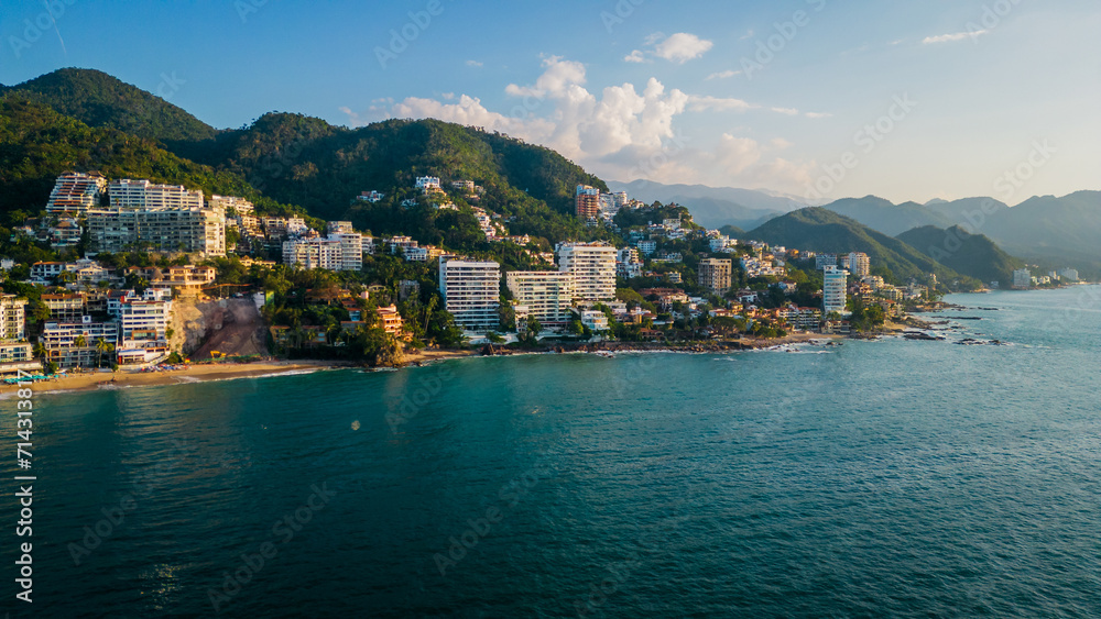 Aerial of Puerto Vallarta Mexico pacific coastline scenic beach at sunset with waterfront hotel resort travel destination
