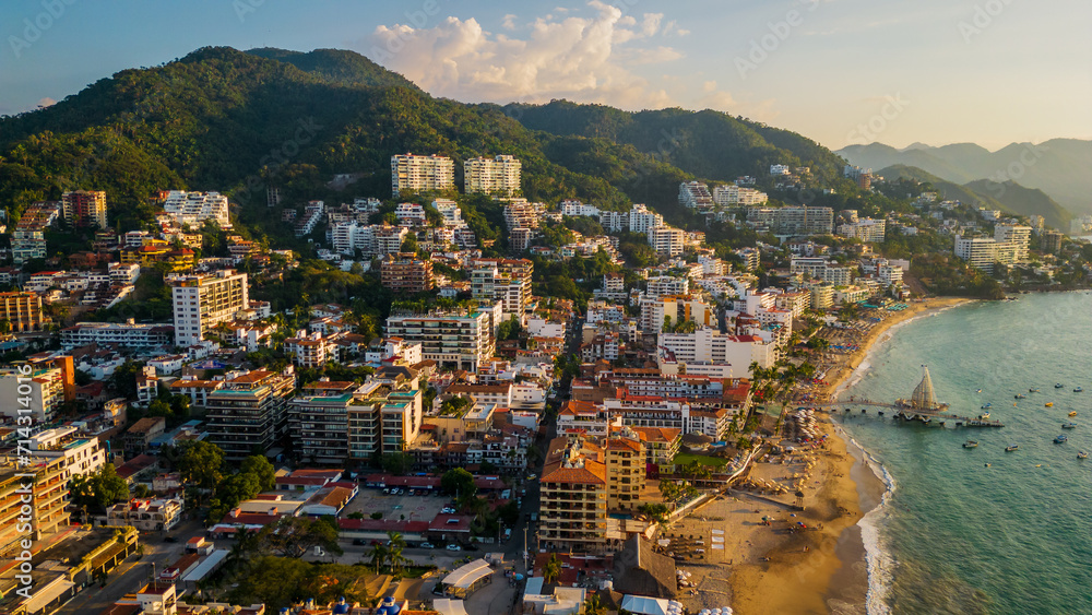 Aerial of Puerto Vallarta Mexico Nayarit pacific coastline at sunset with waterfront hotel in the romantic zone