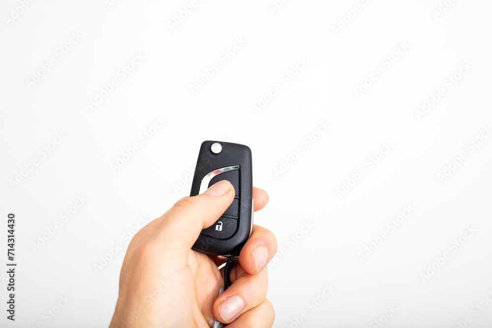 hand holding car remote isolated on white background hand holding car remote isolated on white background
