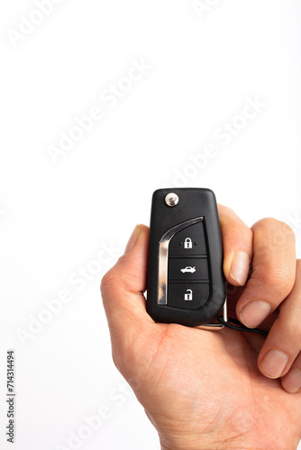 Wallpaper Mural hand holding car remote isolated on white background Torontodigital.ca