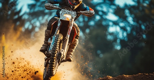 a man riding a dirt bike is taking a leap