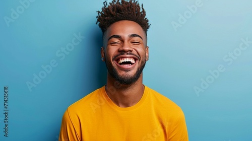 Playful young man making funny faces and spreading joy with his lighthearted expressions. [Playful man making funny faces