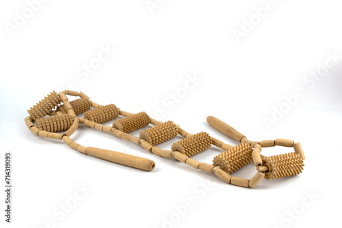 Schilderij op canvas Wooden back massager with handles isolated on a white background.