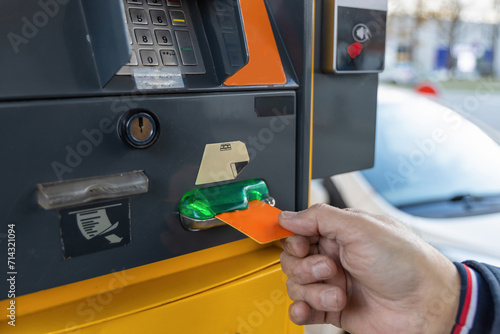 Buying gasoline at a gas station. Refuel gas at the fuel pump. photo