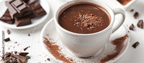 Delicious hot chocolate in cup on white backdrop.