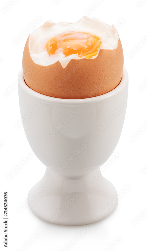 Brown soft-boiled cracked chicken egg in the egg cups isolated on white background. File contains clipping path. Brown soft-boiled cracked chicken egg in the egg cups isolated on white background. File contains clipping path.
