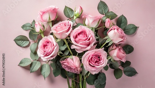 pink rose flowers bouquet on pink background flat lay top view minimal floral composition © Lucia