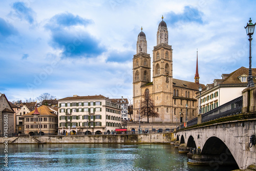 Panoramic view of Zurich city center, Switzerland. Zuerich old town with famous Fraumunster and Munsterbrucke bridge on bank of river Limmat in winter