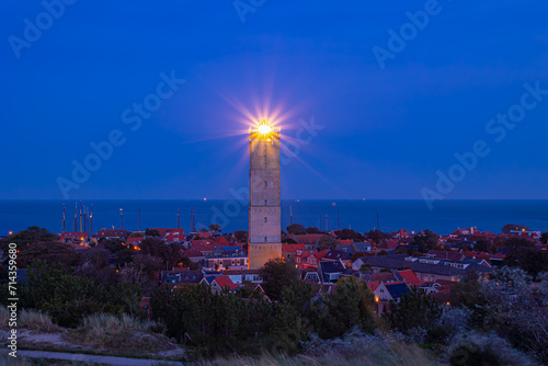 Small town in West-Terschelling in evening, Brandaris lighthouse (Vuurtoren Brandaris) on the Dutch Wadden Sea island Terschelling, A municipality and an island in the northern, Friesland, Netherlands photo