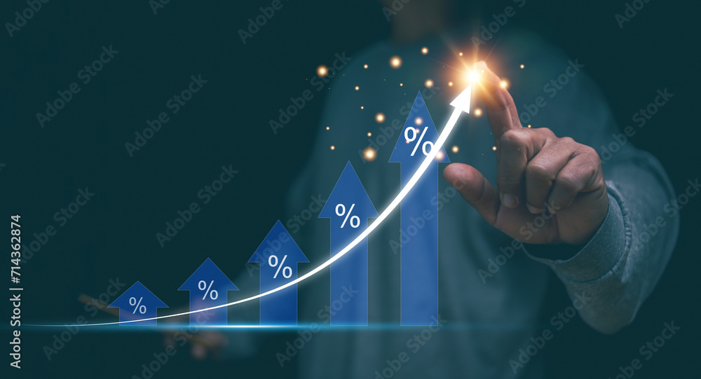Financial interest rates and mortgage rates concept. Businessman pointing to arrow graph corporate future growth plan, Financial investment, Percentage of interest or tax, Marketing plan to target. - obrazy, fototapety, plakaty 