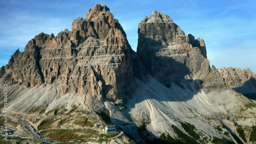 A breathtaking view of the Italian Alps, featuring the iconic Tre Cime di Lavaredo, framed by a serene sky. A breathtaking view of the Italian Alps, featuring the iconic Tre Cime di Lavaredo, framed by a serene sky.