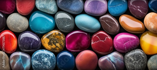 Mesmerizing spectrum of colorful small stones or pebbles creating an abstract background.