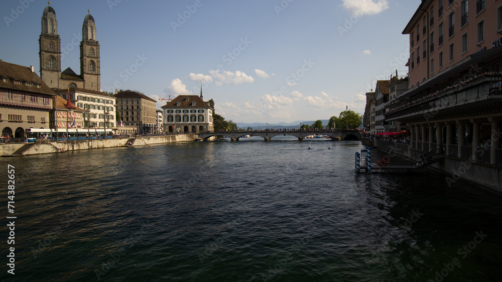 River Flowing Through Urban Landscape With Tall Buildings in Zurich, Switzerland