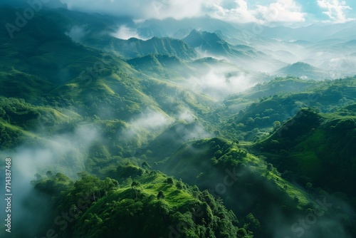 Beautiful aerial landscape. Beautiful summer scenery. Morning fog spreads on the mountain valley. Amazing morning landscape of mountain hills