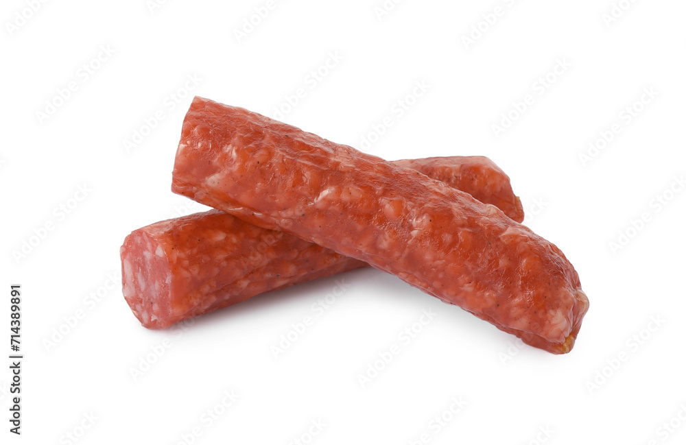 Pieces of thin dry smoked sausage isolated on white Pieces of thin dry smoked sausage isolated on white