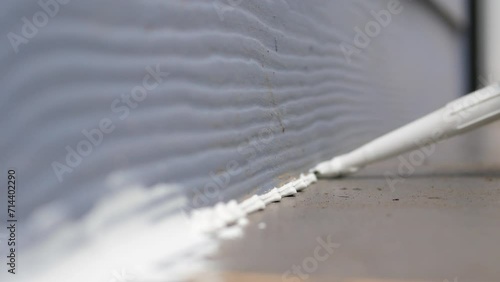 Using silicone adhesive to stop leaks in the wall