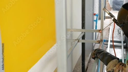 work with metal using a welding machine, bright spark