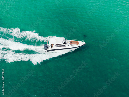 Aerial view of Speed boat at high speed in the aqua sea  Drone view.