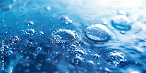 Close up of water bubbles and droplets in a serene blue environment