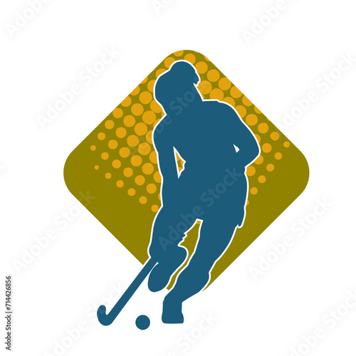 Silhouette of female field hockey athlete in action. Silhouette of a woman playing field hockey sport.