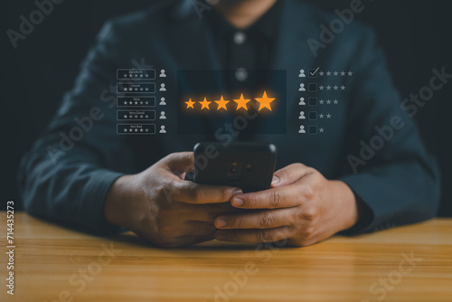 User give rating to service experience on online application, Customer review satisfaction feedback survey concept, Customer can evaluate quality of service leading to reputation ranking of business. photo