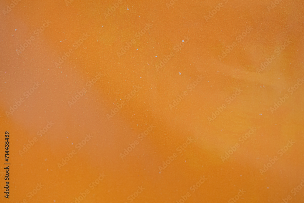 Orange Grunge Textured Wall Background with Abstract Patterns of Aged Paper and Liquid Bubbles on a Rough Surface Orange Grunge Textured Wall Background with Abstract Patterns of Aged Paper and Liquid Bubbles on a Rough Surface