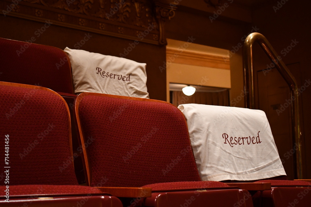 Fotografie Reserved seating covers on theater seats.