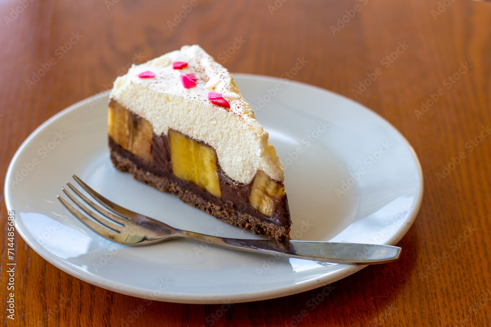 Chocolate Banoffee Pie on white plate. Chocolate Banoffee Pie on white plate.
