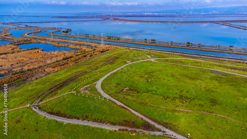 Aerial view of Sunnyvale Bay Trail on top of former landfill. Scenic view of San Francisco Bay with levees, salt marshes and sloughs. photo