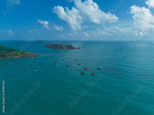 Aerial landscape of bay and sea with fishing boats of Vietnamese fishermen. Concept of tourism and islands. © Story