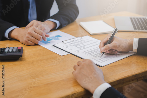 Business finance concept, teamwork and partnership asian businessman customer and salesman discussing client, hand sign sales contract with document at desk office. Lawyers working together at meeting photo